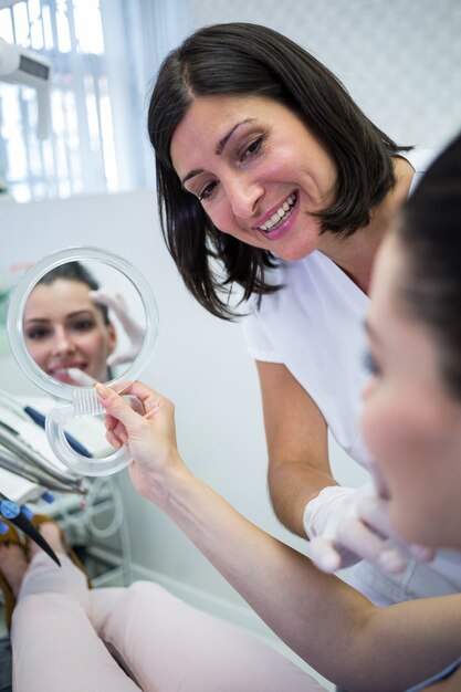 Patient looking at her face in mirror