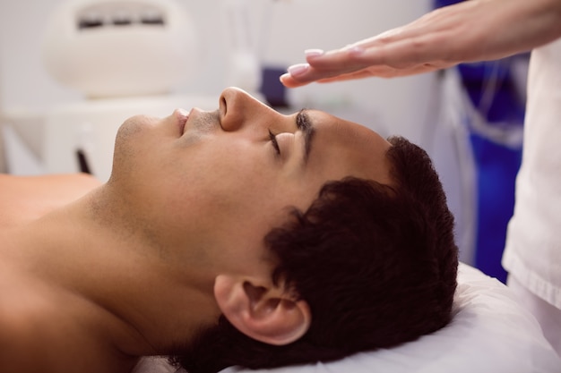 Patient receiving facial treatment