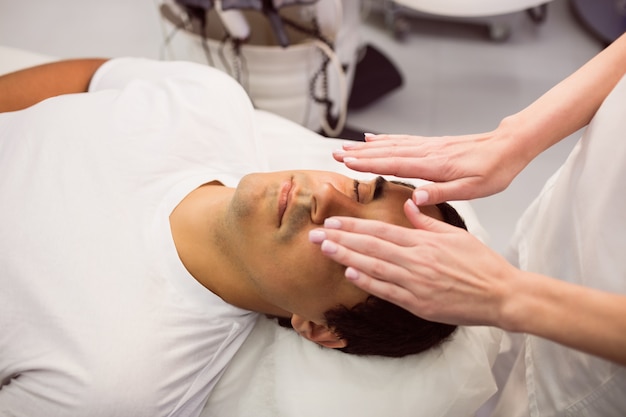 Patient receiving facial treatment