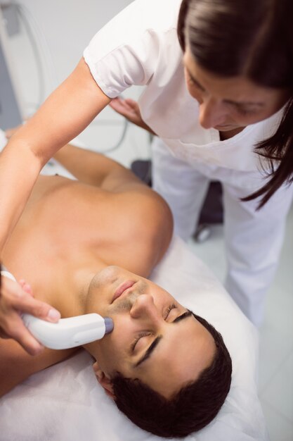 Patient receiving facial treatment