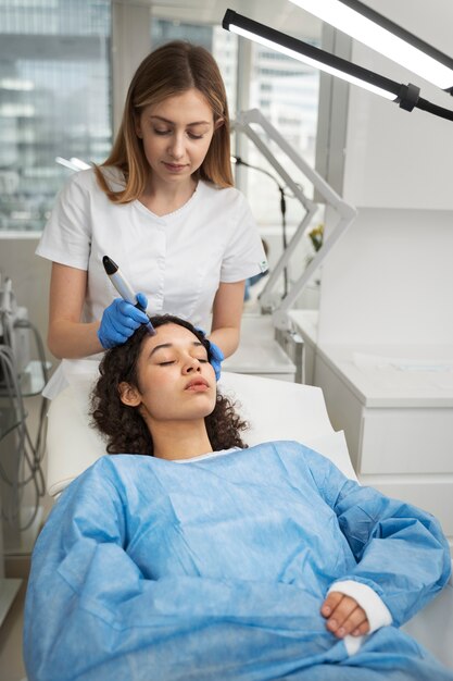 Patient undergoing microneedling procedure