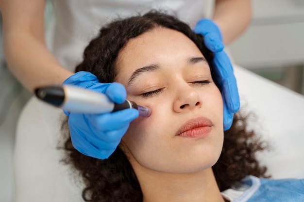 Patient undergoing microneedling procedure