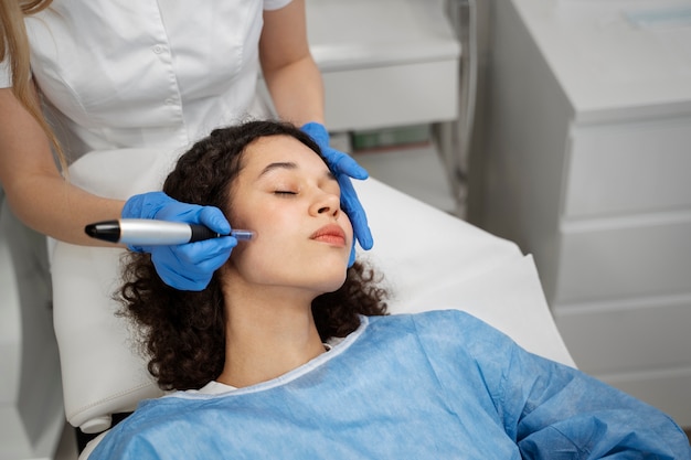 Patient undergoing microneedling procedure