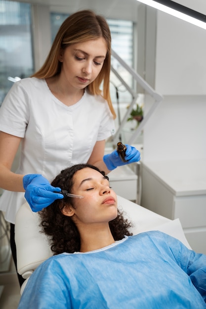 Patient undergoing microneedling procedure