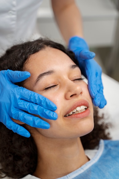 Patient undergoing microneedling procedure