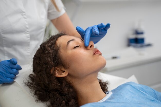 Patient undergoing microneedling procedure