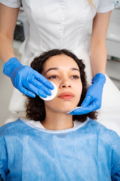 Patient undergoing microneedling procedure