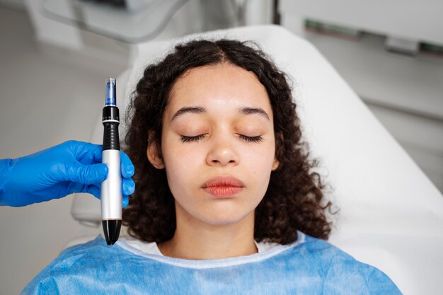 Patient undergoing microneedling procedure