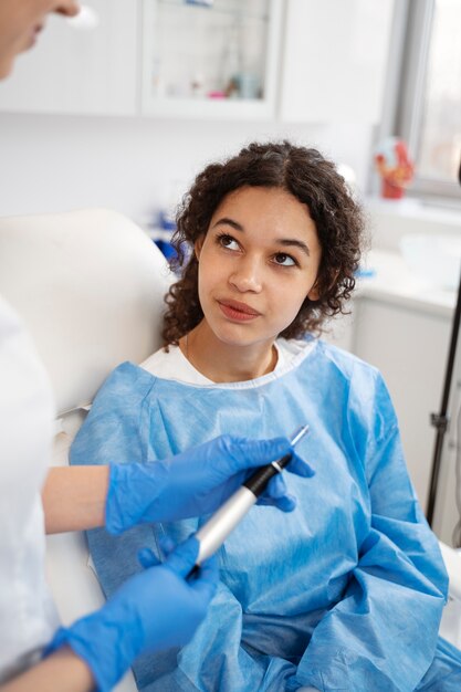 Patient undergoing microneedling procedure