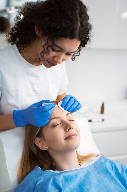 Patient undergoing microneedling procedure