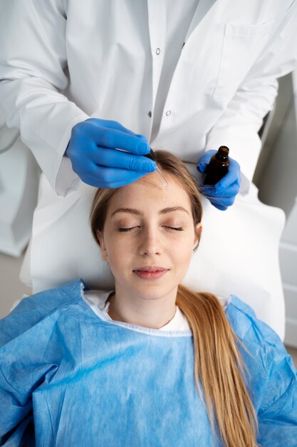 Patient undergoing microneedling procedure