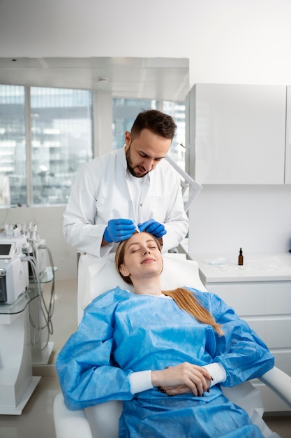 Patient undergoing microneedling procedure