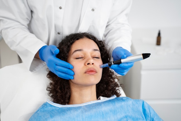 Patient undergoing microneedling procedure