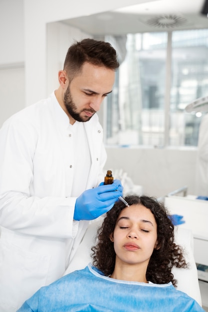 Patient undergoing microneedling procedure