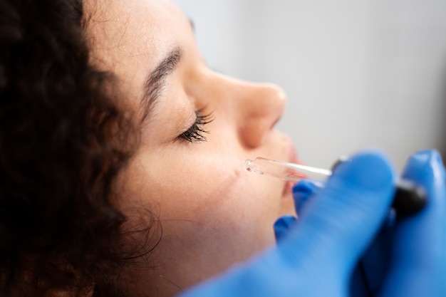 Patient undergoing microneedling procedure