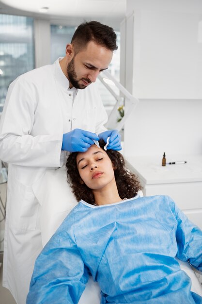 Patient undergoing microneedling procedure