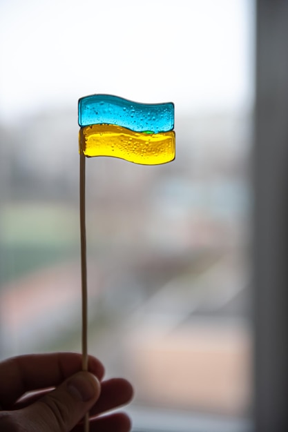 Patriotic lollipop in the shape of the flag of ukraine