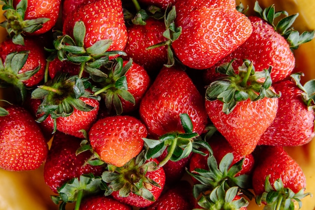 Pattern of fresh ripe strawberries close up view