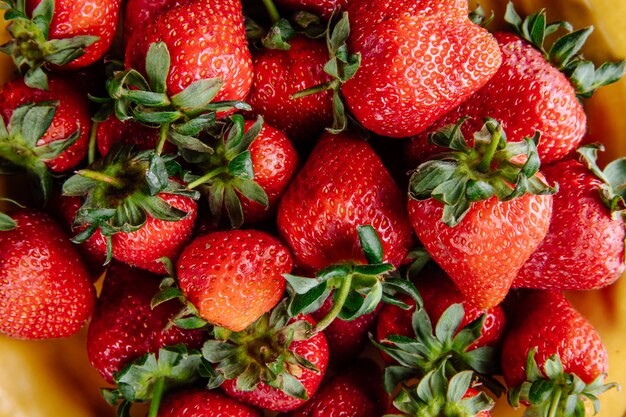 Pattern of fresh ripe strawberries close up view