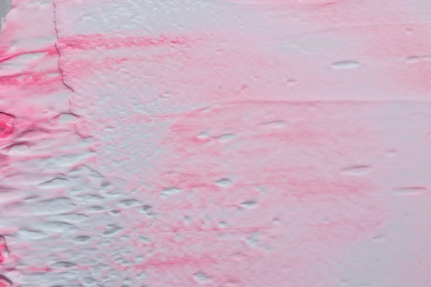 Free photo pattern of rough textured pink and white painted wall