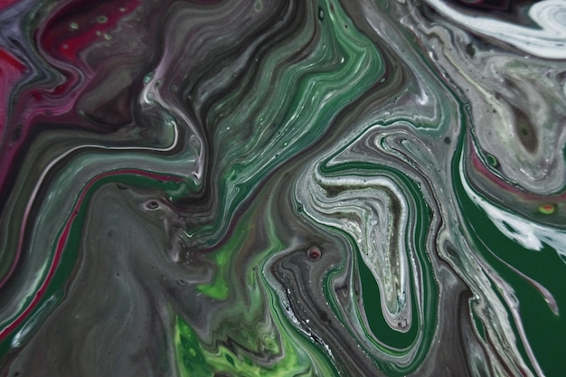 Patterns in the water with colorful mixed paints