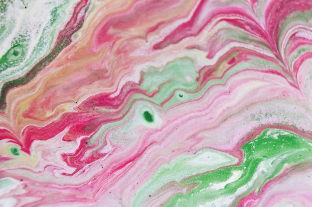 Patterns in the water with colorful mixed paints