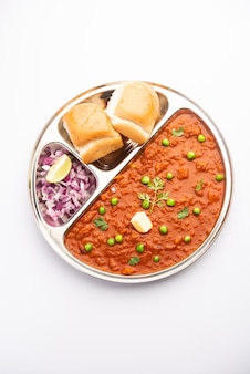 Pav bhaji is a fast food dish from india consisting of a thick vegetable curry served with a soft bread roll