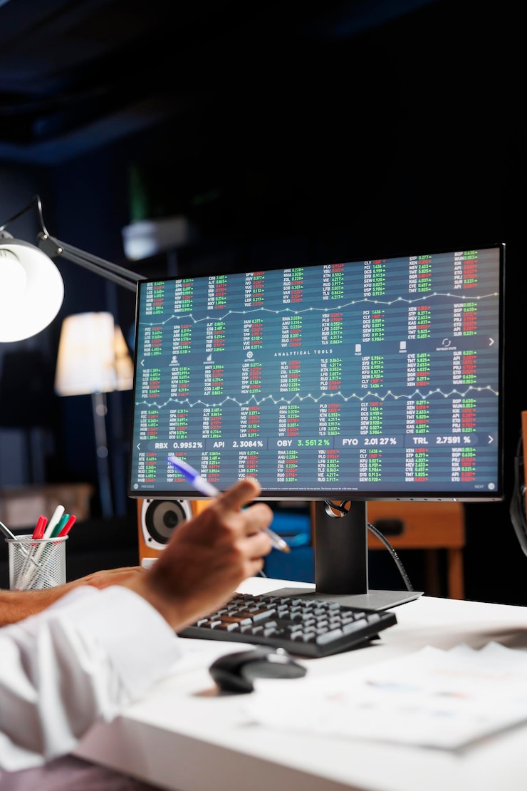 Free Photo pc monitor displaying financial reports