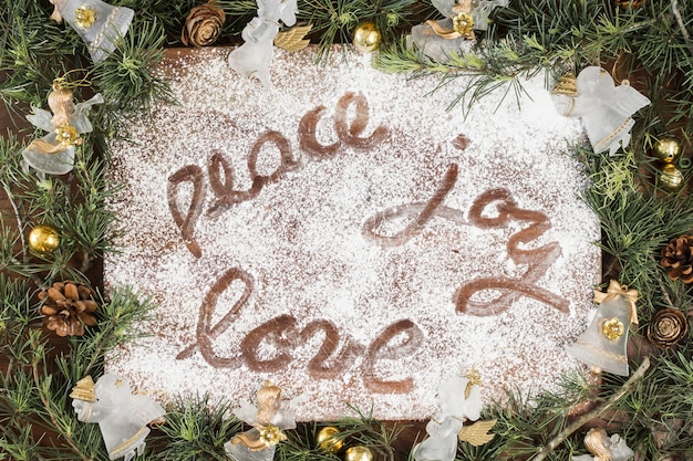 Peace Joy Love inscription on sugar powder 