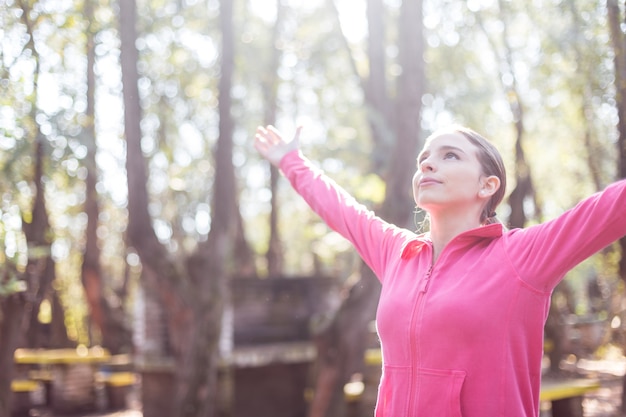 Peaceful girl feeling freedom outdoors