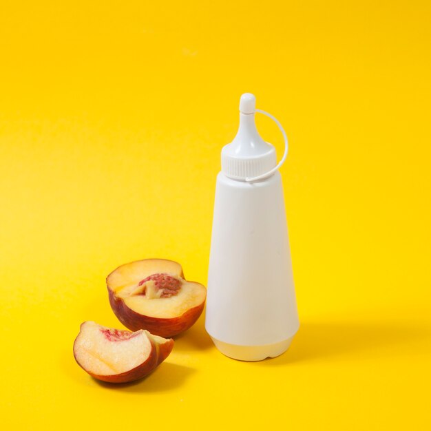 Peach and bottle of topping