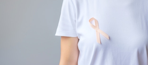 Peach ribbon for september uterine cancer awareness month. healthcare and world cancer day concept