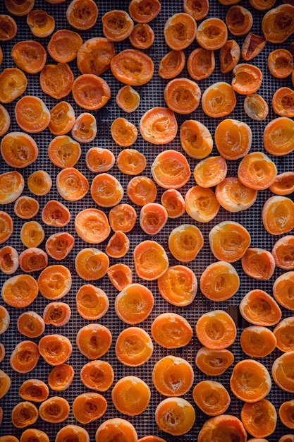 Peaches sliced in two on a tray