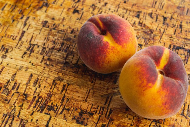 Peaches on wooden table