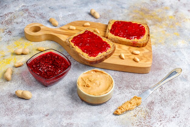 Peanut butter sandwiches or toasts with raspberry jam.