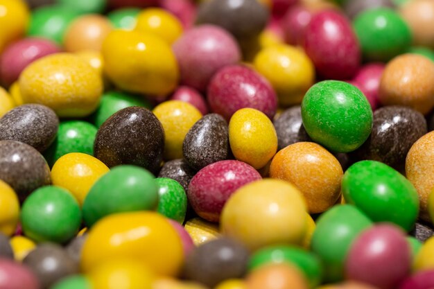 Peanuts covered with multicolored glaze close up
