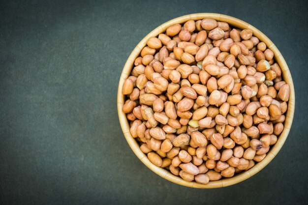 Peanuts in wooden bowl