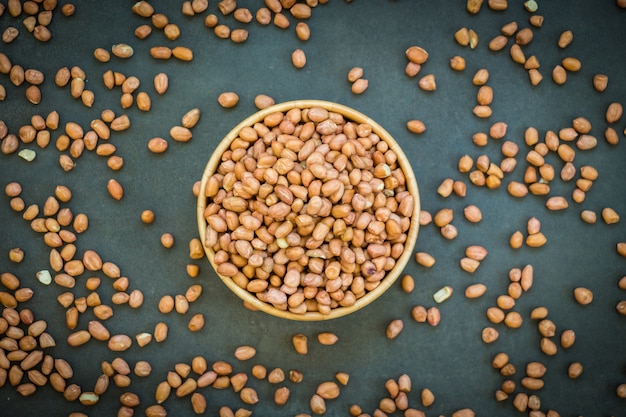 Peanuts in wooden bowl