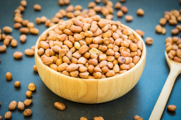 Peanuts in wooden bowl