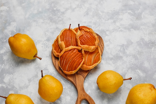 Free photo pear mini galettes on concrete ,top view