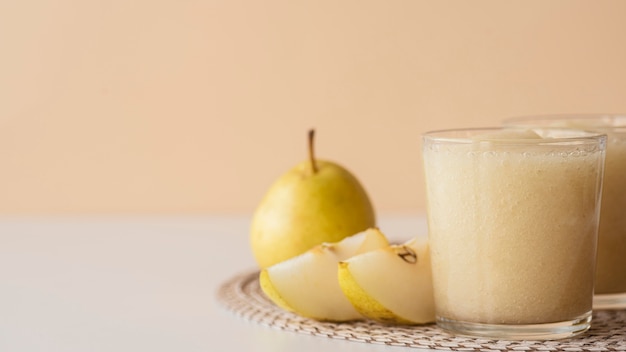 Pear smoothie in glass arrangement