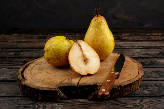 Pears yellow ripe mellow juicy on a wooden desk and rustic brown