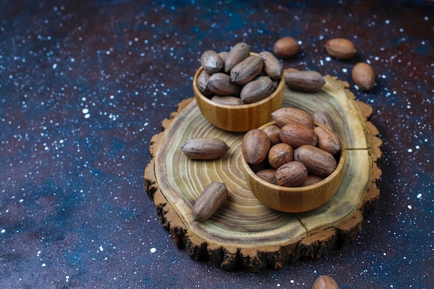 Free photo pecan nuts on light background, top view