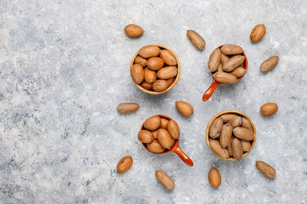 Free photo pecan nuts on light background,top view