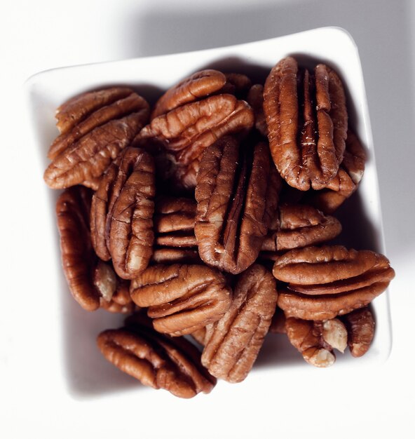 Pecans on white bowl