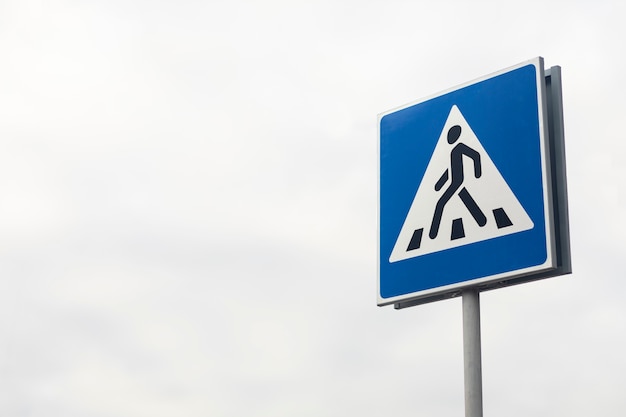 Pedestrian crosswalk sign in the city