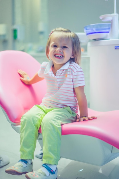 pediatric dentist. Little girl at the reception at the dentist.