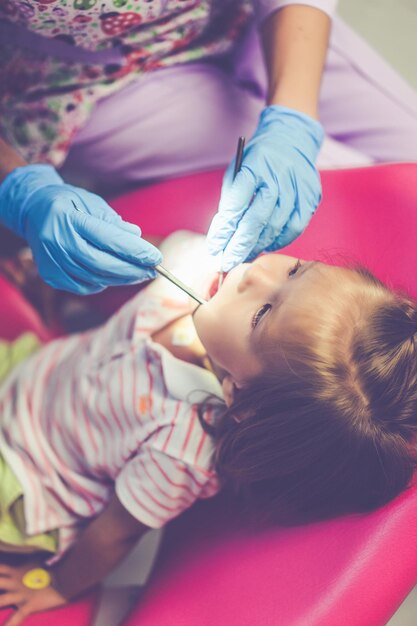 pediatric dentist. Little girl at the reception at the dentist.