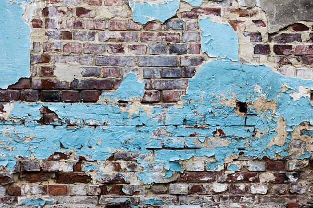 Peeled blue painted brick walls texture