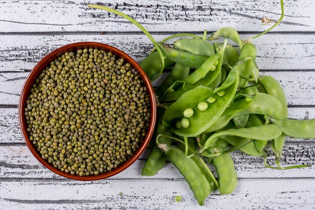 Peeled peas in a bowl and aside